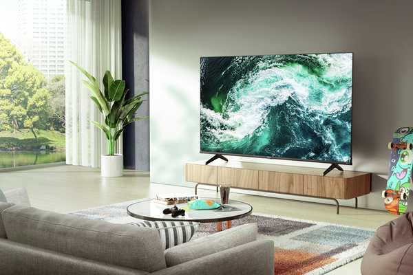 A Hisense smart 4K UHD HDR QLED Freeview TV in a contemporary lounge.